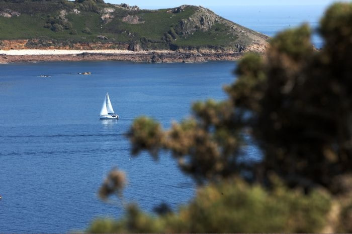 Sailing in Jersey in one of our sandy bays with blue water