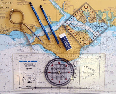 Charts, portland plotter, dividers used on RYA Sailing course